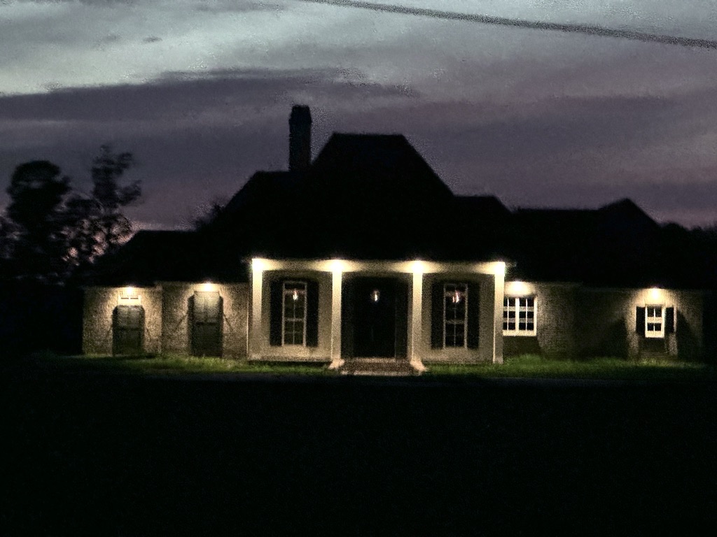 Residential project exterior illuminated at dusk